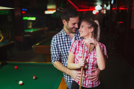 Couple playing snooker togetherの写真素材