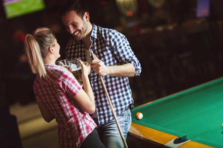 Couple playing snooker togetherの写真素材