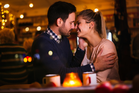 Romantic couple dating at valentines night in pubの写真素材