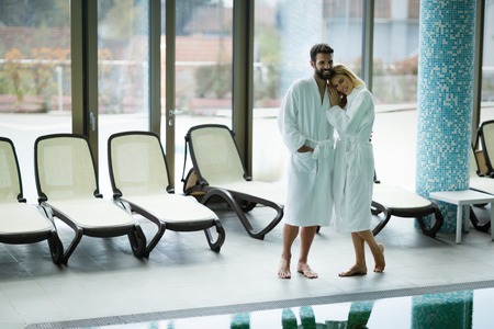 Beautiful couple enjoying spa wellness treatmentsの写真素材