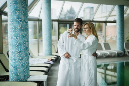 Beautiful couple enjoying spa wellness treatmentsの写真素材