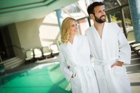 Beautiful couple enjoying spa wellness treatmentsの写真素材