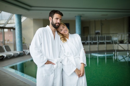 Beautiful couple enjoying spa wellness treatmentsの写真素材