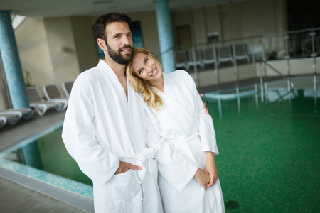 Beautiful couple enjoying spa wellness treatmentsの写真素材