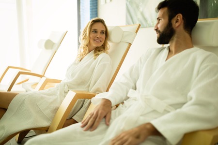 Beautiful couple relaxing in spa centerの写真素材