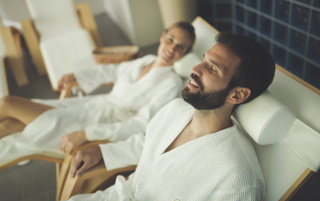 Beautiful couple relaxing in spa centerの写真素材