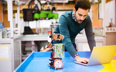 Engineering and robotics student working on projectの写真素材