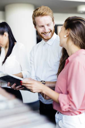 Group of students studying in library and reading booksの写真素材