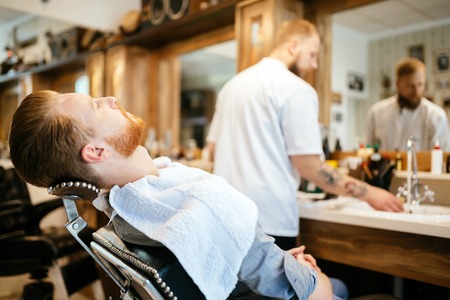 Hair beard and mustache treatment in barber shopの写真素材