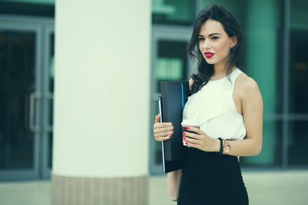 Busy businesswoman in rush  outdoorsの写真素材