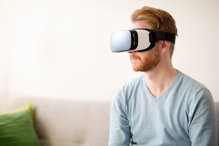 Handsome man wearing future technology VR glasses