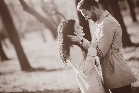 Couple in love bonding outdoors in park