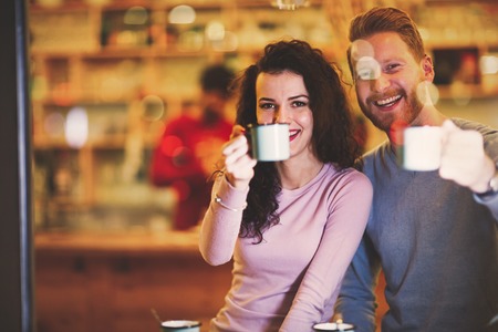 Couple in love dating in restaurant at xmasの写真素材