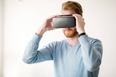 Handsome man wearing future technology VR glasses
