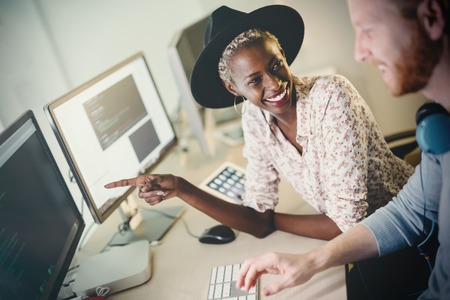 Programmers cooperating at  IT company developing appsの写真素材