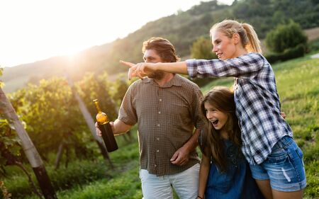 Wine grower and people in winery vineyardの写真素材