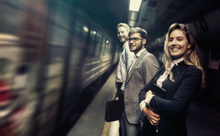 Business people waiting for transportation undergroundの写真素材