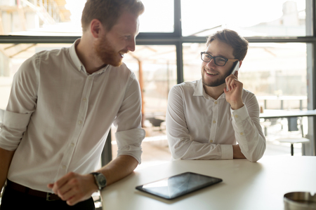 Busy business people working on break in cafeの写真素材