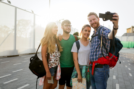 Young happy students taking selfie and laughingの写真素材