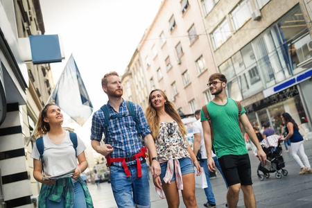 Happy group of tourists traveling and sightseeing togetherの写真素材