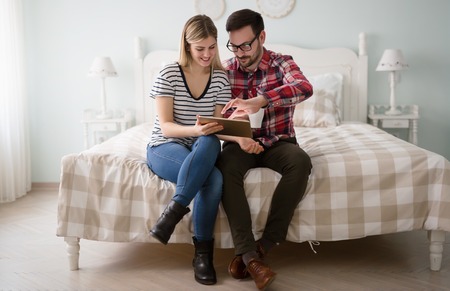 Leisurly couple in love shopping online using tabletの写真素材