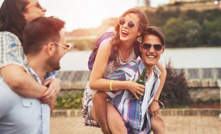 Happy young people attending festivals at summer having funの写真素材