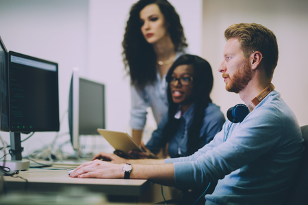 Programmer working in a software developing company officeの写真素材