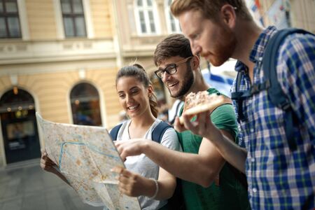 Tourist group of  friends discovering city on foot and travelling