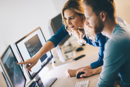 Programmer working in a software developing company officeの写真素材