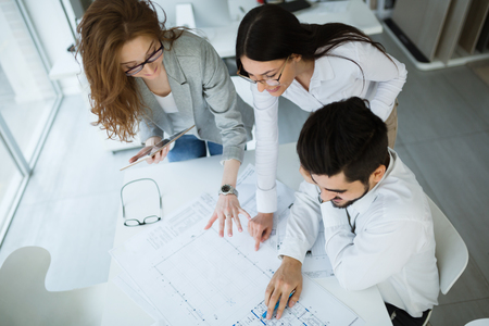 Business meeting and cooperation by business people in officeの写真素材