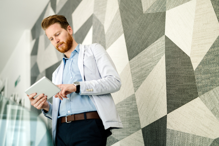 Business people using phones and devicesの写真素材