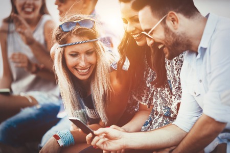 Group of friends having fun outdoors and are happyの写真素材