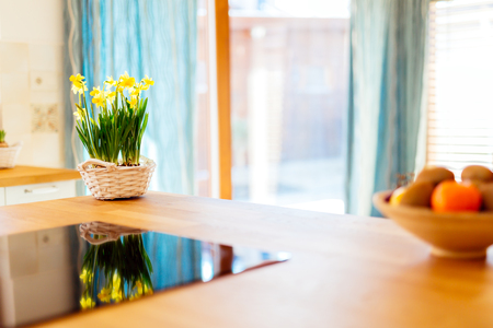 Flowers on kitchen counter make it livelyの写真素材