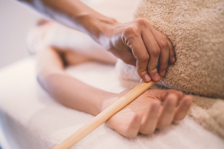 Hand and palm massage by therapist at spa resortの写真素材