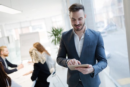 Handsome businessman ceo working in company officeの写真素材