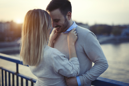 Beautiful couple in love dating and hugging outdoorの写真素材