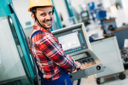 industrial factory worker working in metal manufacturing industry