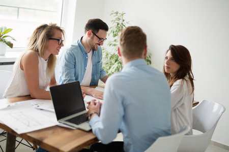 Designers working on new project in modern officeの写真素材