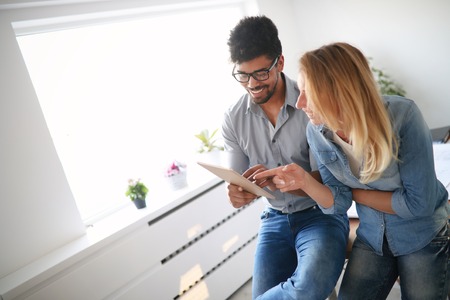 Coworkers working at business office and using tabletの写真素材