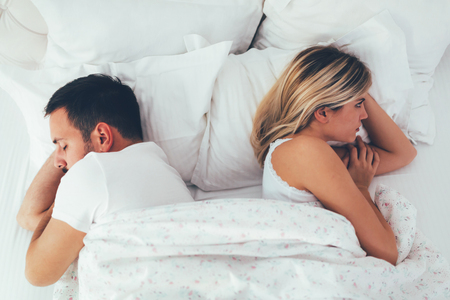 Unhappy young couple having unsolved relationship problemsの写真素材