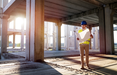 Picture of construction site engineer looking at planの写真素材