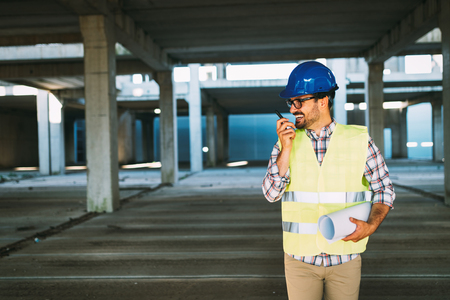 Picture of construction site engineer looking at planの写真素材