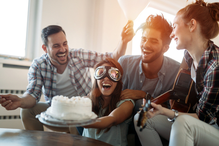 Cheerful young friends having fun on partyの写真素材