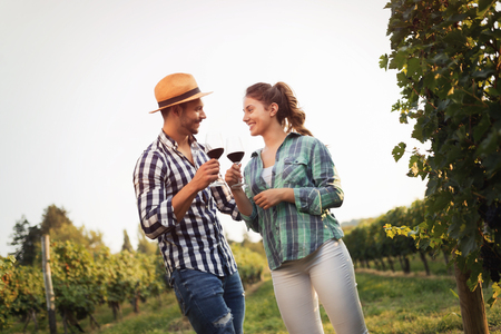 Romantic couple in vineyard before harvestingの写真素材