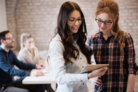Picture of two young female designers using tabletの写真素材