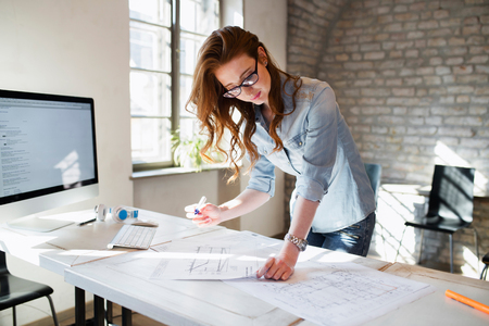 Portrait of young female architect working on projectの写真素材