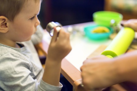 Little boy working with clayの写真素材