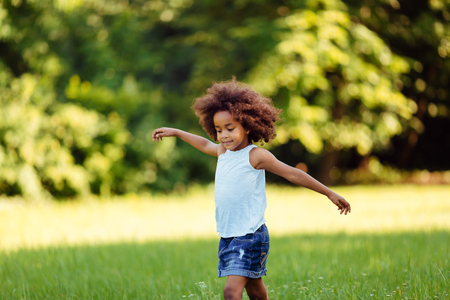 Portrait of little girl walking in natureの写真素材