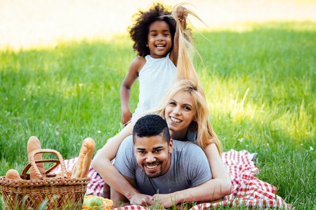 Happy family having fun time on picnicの写真素材