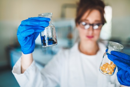 Female student of chemistry working in laboratoryの写真素材